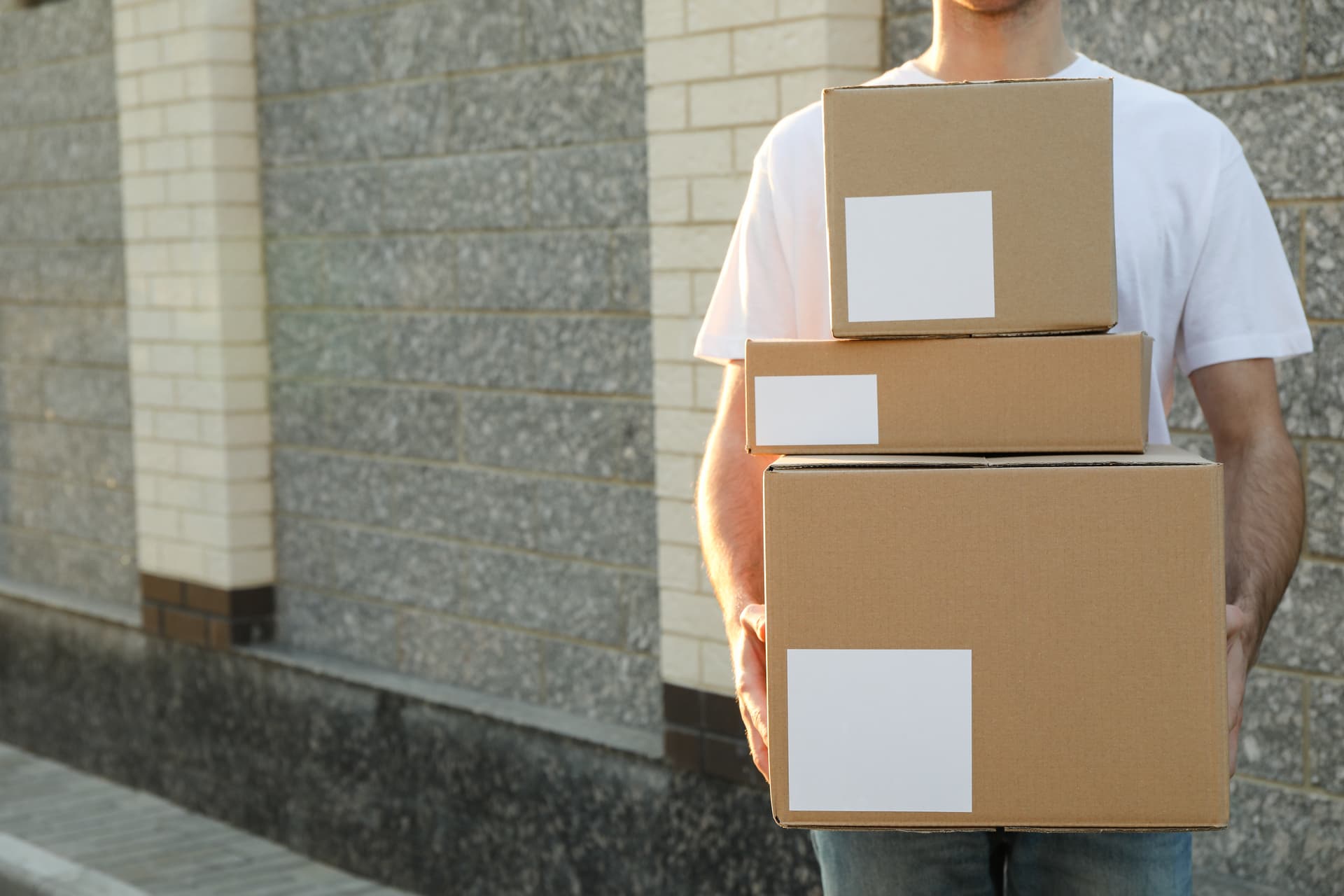 medium-vecteezy_delivery-man-hold-blank-boxes_73823595_medium (1) manual handling training Ireland on-site group course